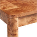 Close-up of the rounded corner and thick leg of Crate & Barrel Emerson 60" Mappa Burl Desk, showcasing the natural mappa burl wood grain
