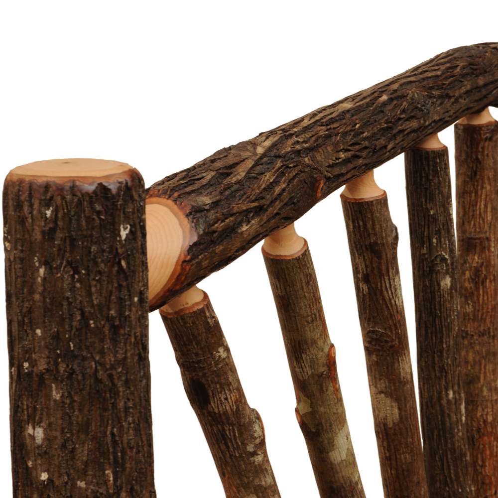 Close-up of the rounded hickory log spindles and bark texture on the headboard of Fireside Lodge Hickory Log Sunburst Bed
