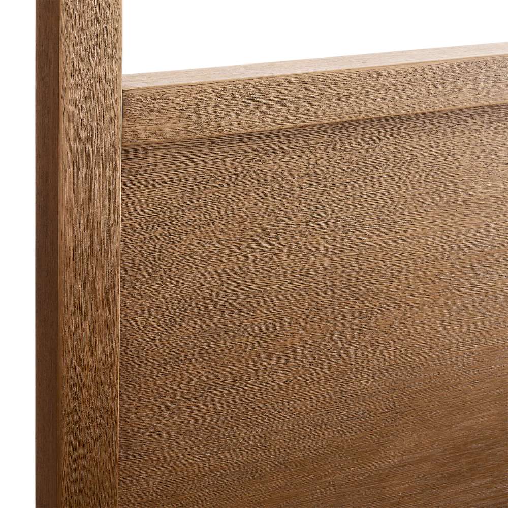 Close-up of the solid wood headboard on Crate & Barrel Keane Solid Driftwood Queen Canopy Bed highlighting the natural wood grain