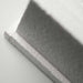 Close-up of the textured edge and recessed channel of a white GIK Acoustics GridFusor™ Diffuser, highlighting its sound-scattering design