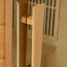 Close-up of the vertical wood door handle on the glass door of Golden Designs Maxxus 3 Person Low EMF Far Infrared Sauna in Hemlock