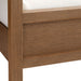 Close-up of the wood frame and footboard corner on Crate & Barrel Keane Solid Driftwood Queen Canopy Bed showing the driftwood finish