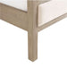Close-up of the wood leg and corner frame on Crate & Barrel Keane Weathered Natural Wood Upholstered Queen Bed highlighting its weathered natural finish