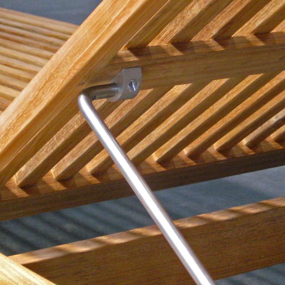 Close-up view of Westminster Teak Horizon Chaise Lounger shows its metal support bar holding the adjustable backrest in place beneath the wooden slats