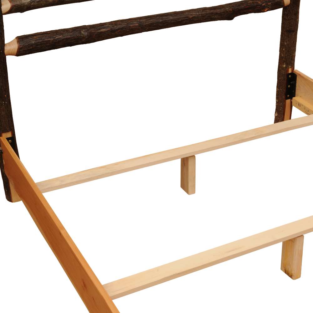 Close-up view of the unfinished wooden slats and log rails forming the sturdy base of Fireside Lodge Hickory Log Sunburst Bed