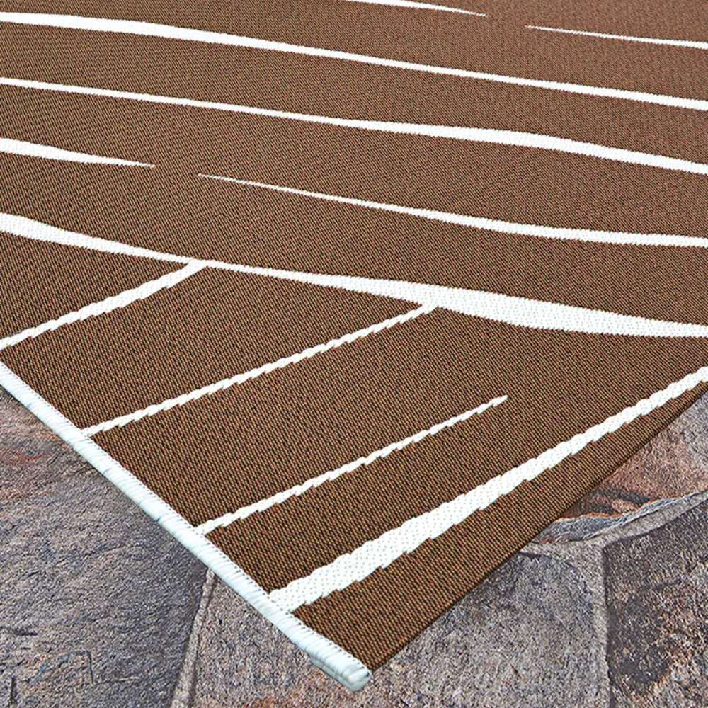 Close-up corner of Couristan Dolce Indoor/Outdoor Rug - Parquet/Amber showcases its tightly woven amber surface with ivory diagonal lines