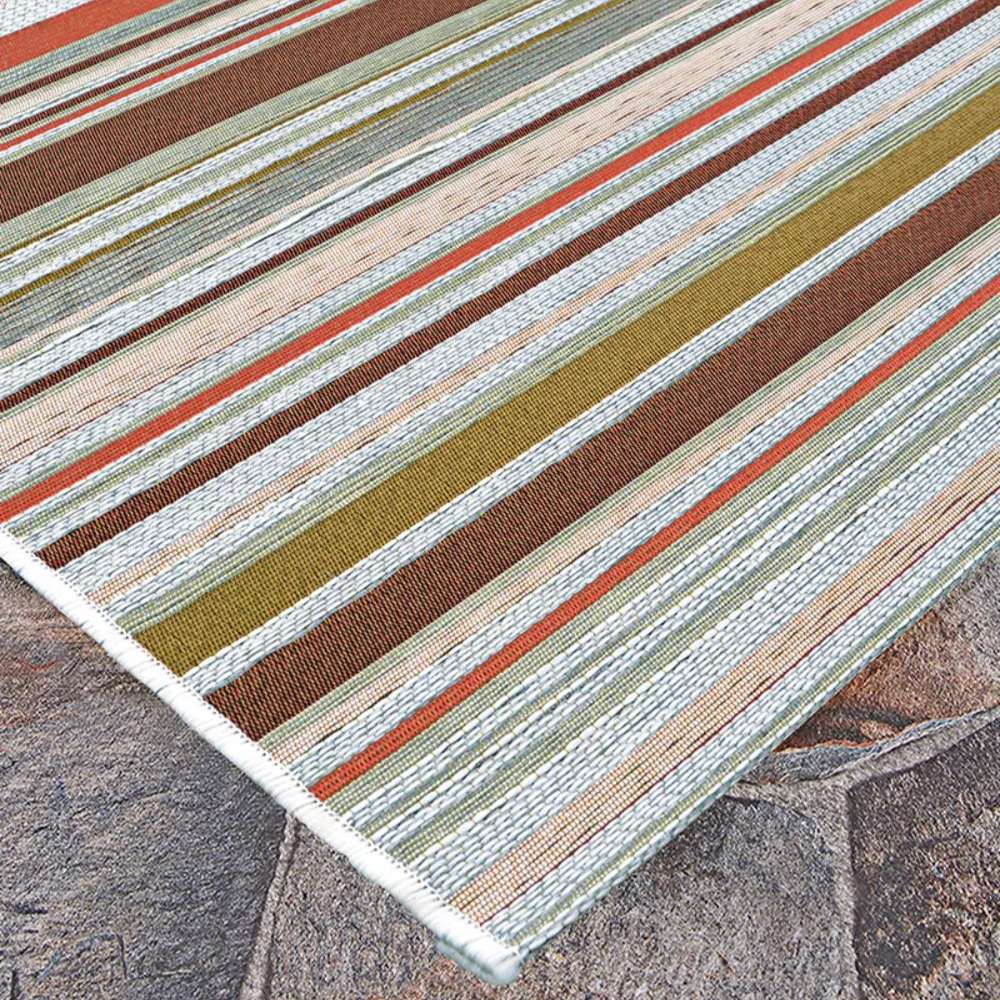 Close-up of Couristan Dolce Indoor/Outdoor Rug - Striped/Sunset shows its colorful horizontal stripe pattern with textured weaves