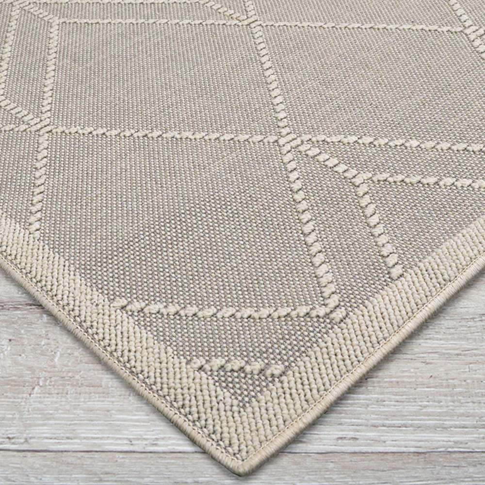 Close-up of Couristan Liguria Indoor/Outdoor Rug - Noli/Dove Grey reveals its tightly woven texture and ivory-lined geometric design