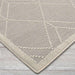 Close-up of Couristan Liguria Indoor/Outdoor Rug - Noli/Dove Grey reveals its tightly woven texture and ivory-lined geometric design