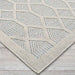 Close-up of Couristan Liguria Indoor/Outdoor Rug - Rapallo/Aqua displays its textured diamond weave along the edge