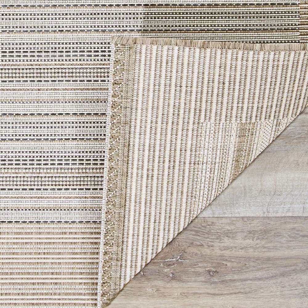 Close-up of Couristan Monaco Indoor/Outdoor Rug - Bowline/Cocoa Natural-Ivory shows its woven texture with a corner flipped to reveal the backing