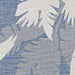 Close-up of Couristan Monaco Indoor/Outdoor Rug - Coastal Flora/Ivory-Sapphire shows large ivory leaf patterns against a sapphire background