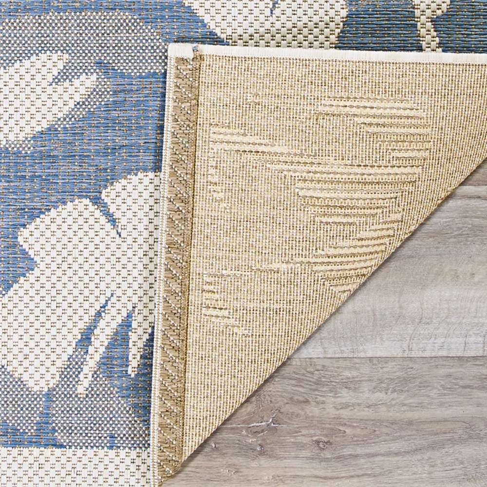 Close-up of Couristan Monaco Indoor/Outdoor Rug - Coastal Flora/Ivory-Sapphire shows the detailed woven texture and neatly finished edges