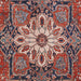 Close-up of Momeni Afshar Indoor Rug - AFS37 Red reveals its ornate medallion centerpiece in vibrant red and blue hues