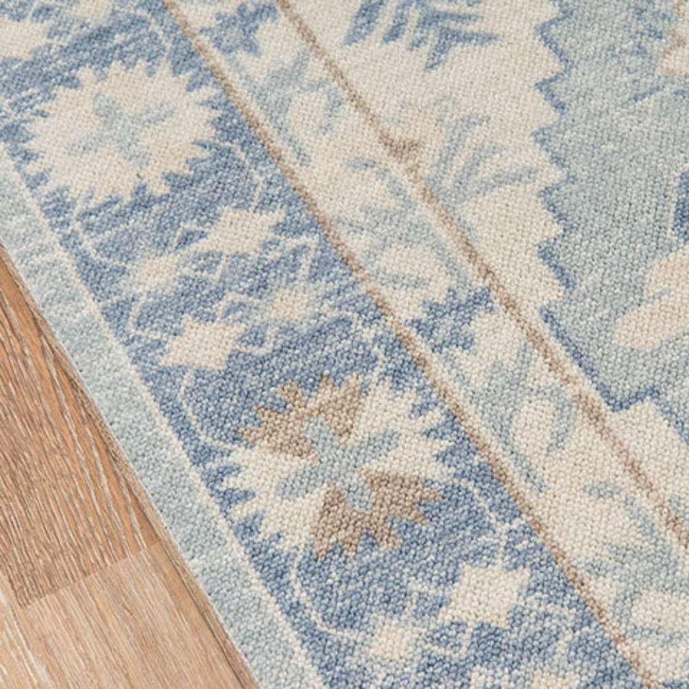 Close-up of Momeni Anatolia Indoor Rug - ANA-1 Blue shows detailed border patterns in muted blue and cream
