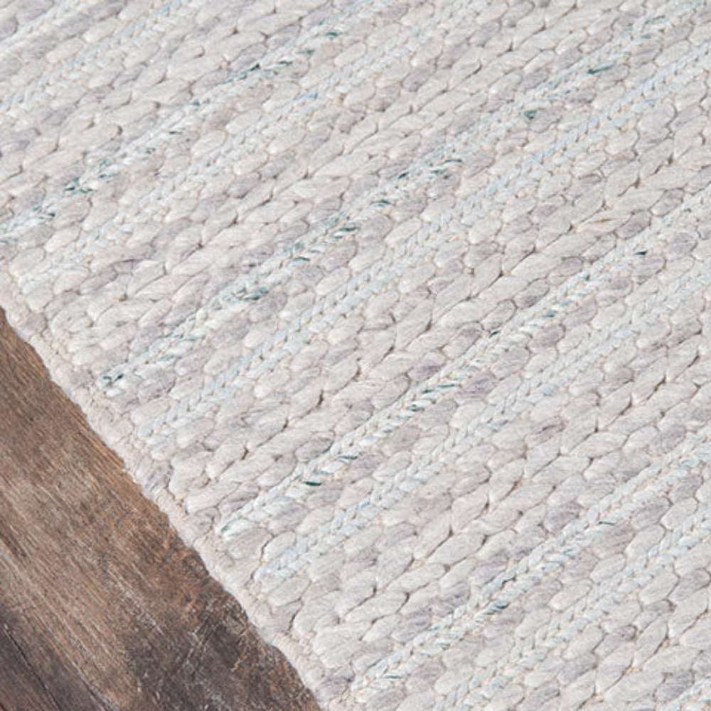 Close-up of Momeni Andes Indoor Rug - AND-4 Light Grey highlights its tightly woven braided pattern