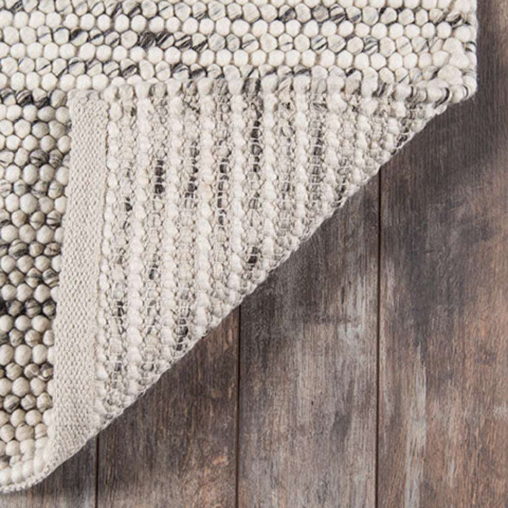 Close-up of Momeni Andes Indoor Rug - AND-8 Ivory showing its thick, handwoven wool texture with ivory and gray tones