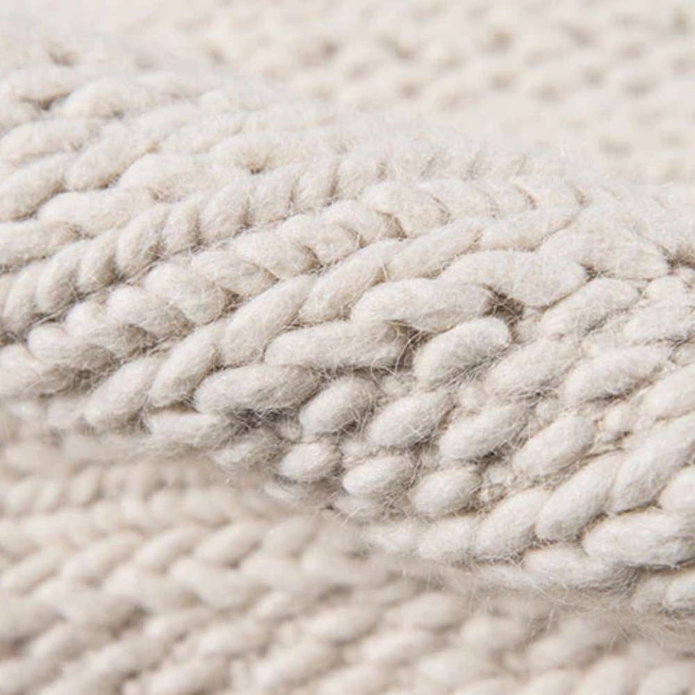Close-up of Momeni Andes Indoor Rug - AND-9 Ivory reveals its thick, handwoven wool fibers
