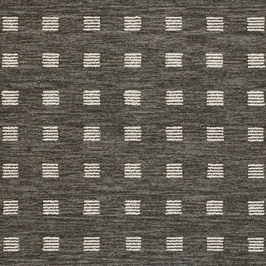 Close-up of Momeni Archer Indoor Rug - ARC-1 Charcoal shows its flexible, soft material with a sturdy edge finish