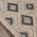 Close-up of the Momeni Andes Indoor Rug - AND-2 Beige shows its handwoven wool texture and geometric diamond detailing
