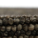Close-up of the thick wool loops shows the cozy, natural texture of Momeni Andes Indoor Rug - AND-8 Charcoal