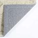 Close-up of the underside of Momeni Anatolia Indoor Rug - ANA-5 Beige shows its sturdy backing