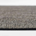 Close-up side view shows the flat woven texture of Momeni Andes Indoor Rug - AND-8 Charcoal