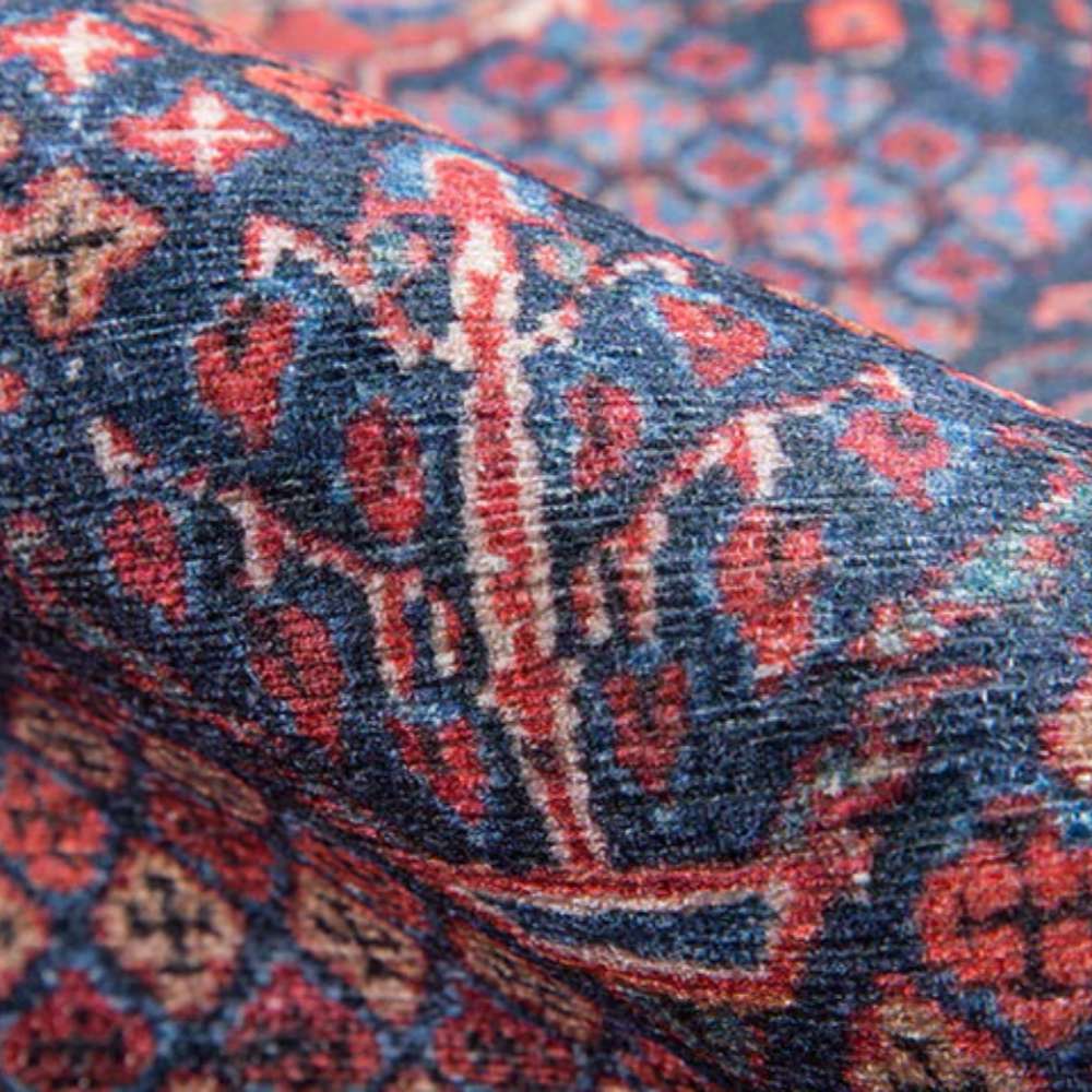Close-up texture of Momeni Afshar Indoor Rug - AFS10 Navy showing its soft woven surface and traditional red and navy motifs