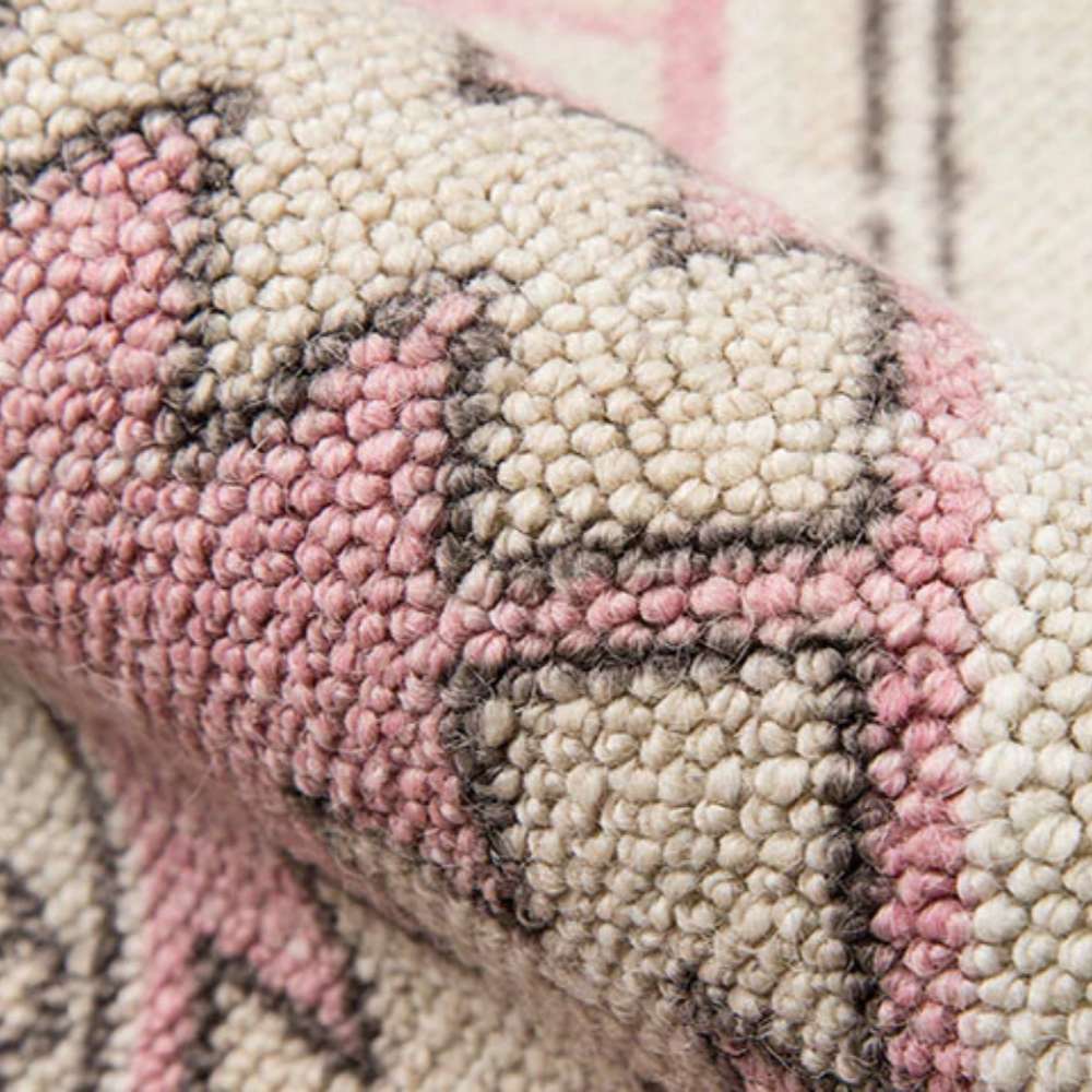 Close-up view highlights the woven texture and soft pastel tones of Momeni Anatolia Indoor Rug - ANA-2 Pink