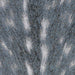 Close-up view of Couristan Dolce Indoor/Outdoor Rug - Hyena/Denim-Silver shows its artistic streaks of ivory on a denim background