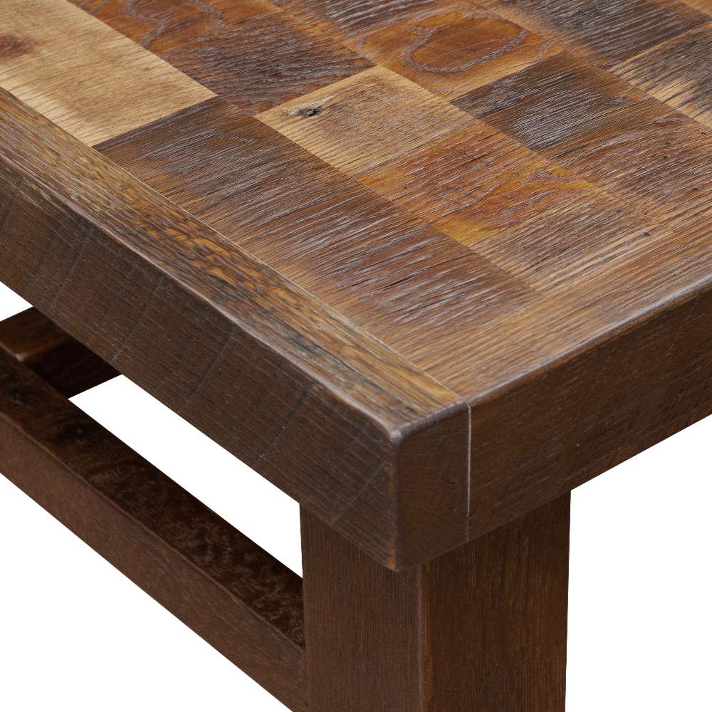 Close-up view of Fireside Lodge Barnwood Americana Coffee Table - 42 Inch highlighting its rustic, textured wood grain and handcrafted patchwork surface