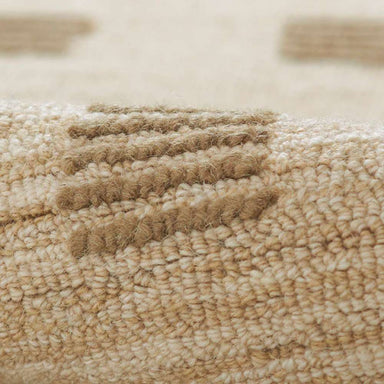 Close-up view of Momeni Archer Indoor Rug - ARC-1 Beige shows its soft woven texture with raised square patterns