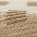 Close-up view of Momeni Archer Indoor Rug - ARC-1 Beige shows its soft woven texture with raised square patterns