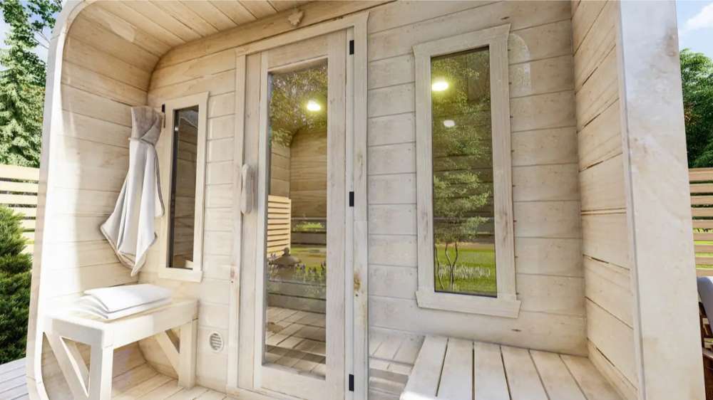 Close-up view of Sawmill Structures Box Sauna entrance with hooks, benches, and windows