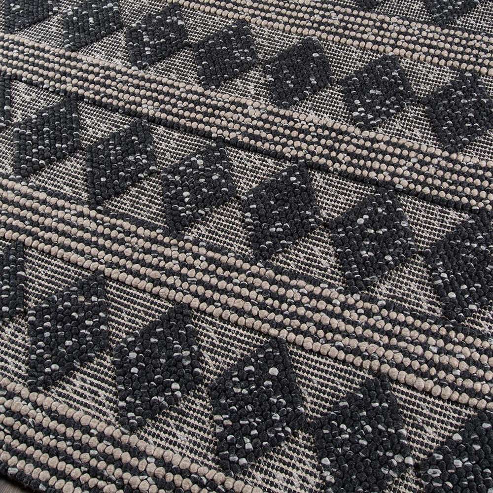 Close-up view of the textured diamond pattern on Momeni Andes Indoor Rug - AND-1 Charcoal