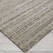 Close-up view shows Couristan Fez Indoor/Outdoor Rug - Riad/Ash with a soft ash-gray base and subtle geometric patterns woven across the surface