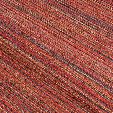 Close-up of the Couristan Cape Indoor/Outdoor Rug - Hinsdale/Crimson-Multi highlights the multicolored red, orange, and dark stripe pattern