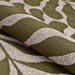 Close-up of the Couristan Castille Indoor/Outdoor Rug - Fiore/Tea Leaf highlights its textured surface with flowing beige and green patterns