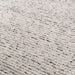Close detail of Momeni Andes Indoor Rug - AND-8 Ivory showcasing its hand-felted wool loops in natural ivory shades