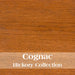 Cognac Fireside Lodge Hickory Log Blanket Chest shows medium golden-brown wood with smooth grain and a rich warm finish