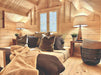 Comfy lounge nook with plush pillows, soft lighting, and a central window is featured in the Sawmill Structures Ontario Grand Loft 107 SD Garden Room