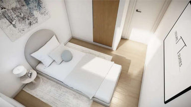 Compact bedroom with minimalist décor and light wood flooring is part of Sawmill Structures The Banff Garden Suites
