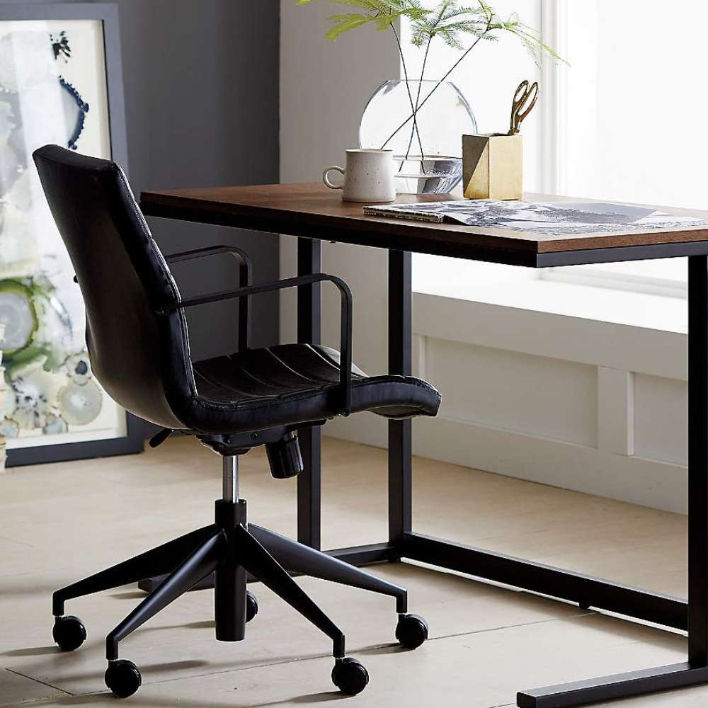 Contemporary workspace featuring the Crate & Barrel Graham Black Office Chair beside a minimalist desk