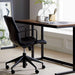 Contemporary workspace featuring the Crate & Barrel Graham Black Office Chair beside a minimalist desk