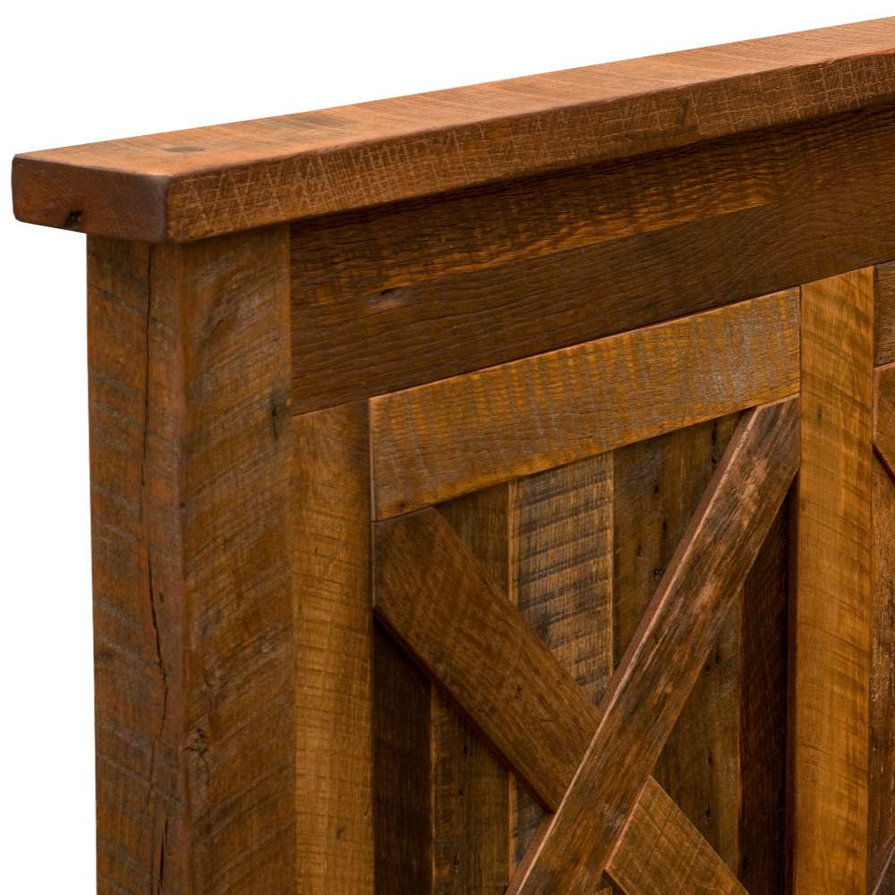 Corner of Fireside Lodge Barnwood Barndoor Bed headboard with rough barnwood texture and visible grain