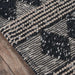 Corner detail of Momeni Andes Indoor Rug - AND-1 Charcoal highlights its sturdy weave and modern geometric pattern