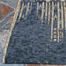Corner of Couristan Dolce Indoor/Outdoor Rug - Blue Nile/Indigo lies neatly on a stone patio