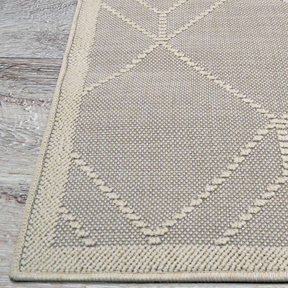 Corner of Couristan Liguria Indoor/Outdoor Rug - Noli/Dove Grey shows its neat ivory border and raised diamond-shaped patterns