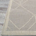 Corner of Couristan Liguria Indoor/Outdoor Rug - Noli/Dove Grey shows its neat ivory border and raised diamond-shaped patterns