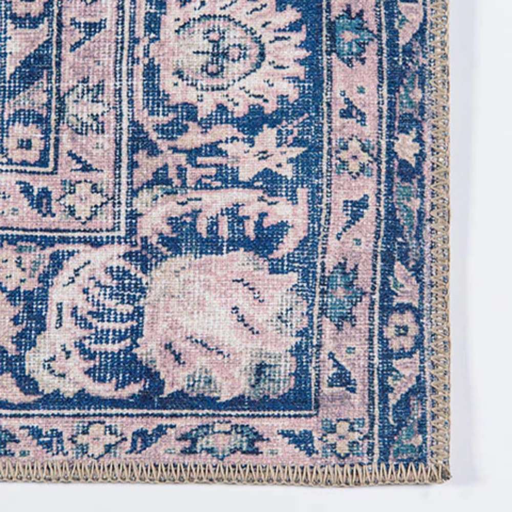 Corner view highlights the intricate border pattern of Momeni Afshar Indoor Rug - AFS30 Pink